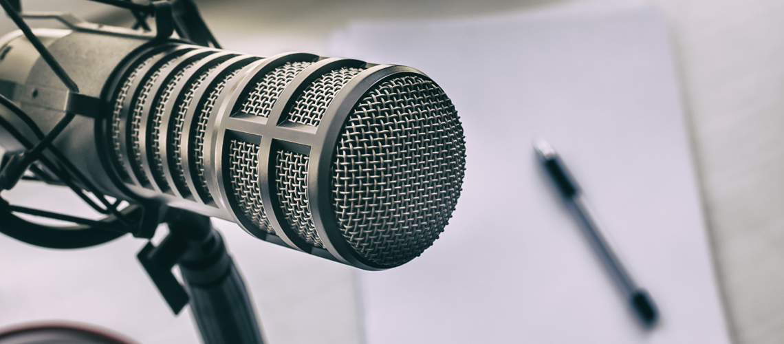 microphone with a notebook in background