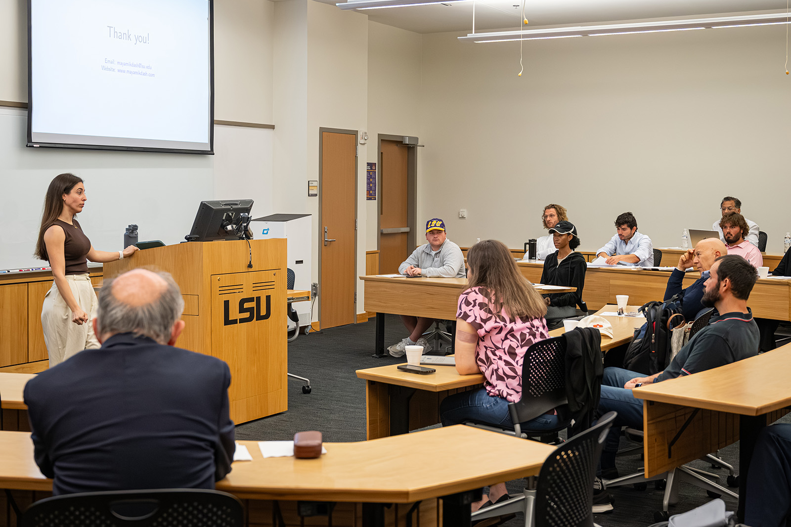 Professor answering questions at workshop
