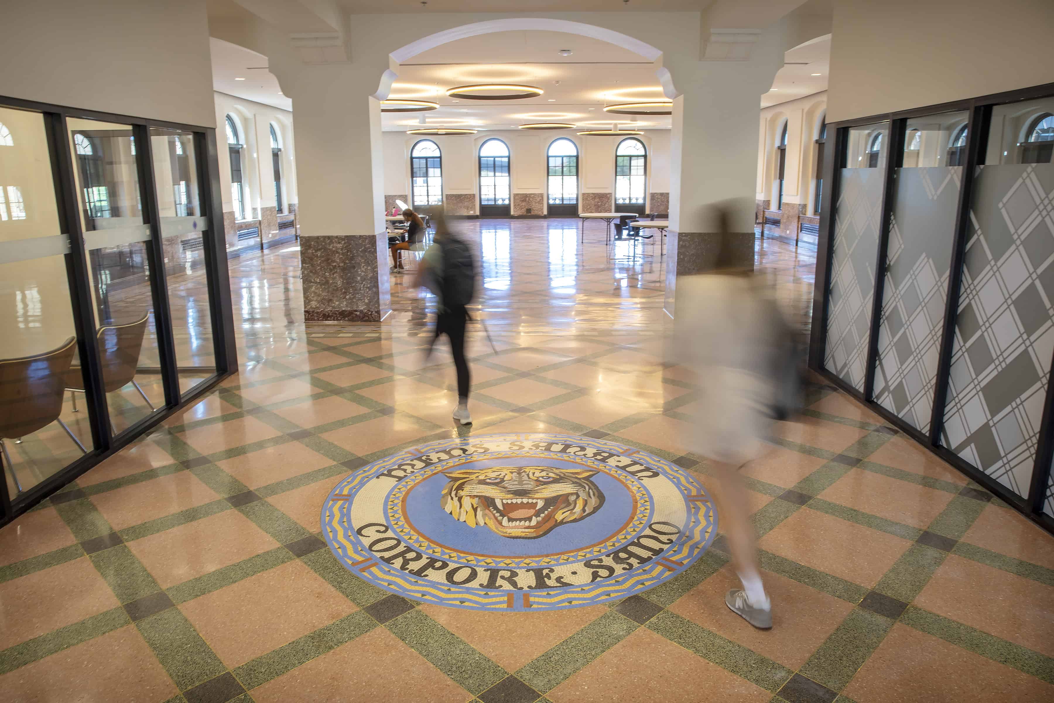 Students walking in the lobby of the Huey P. Long Field House