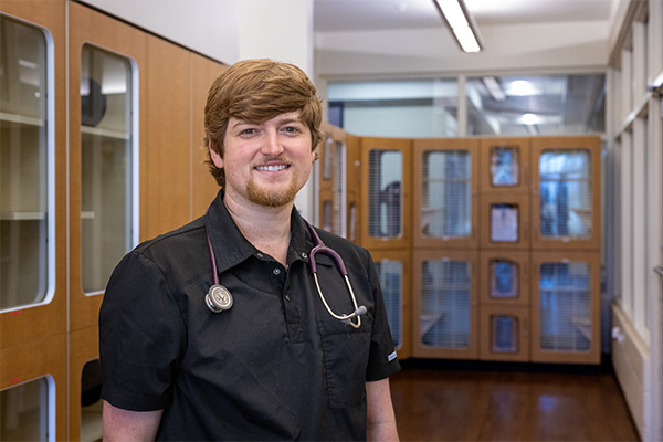 Tanner Hernadez in the cat adoption area of CAA